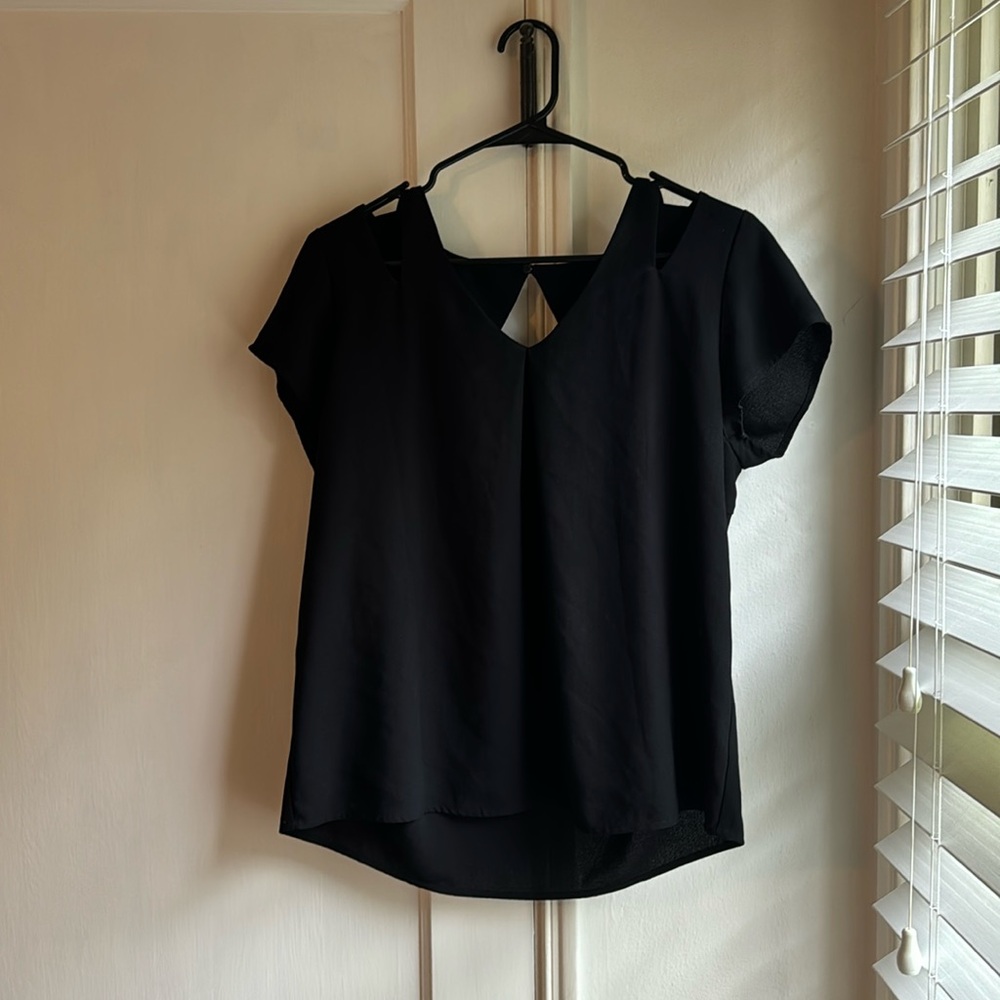 Black short sleeve blouse with cut-out details around shoulders and back, size M